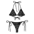 AI generated image of a Black Hibiscus pattern recycled string bikini Product shot front