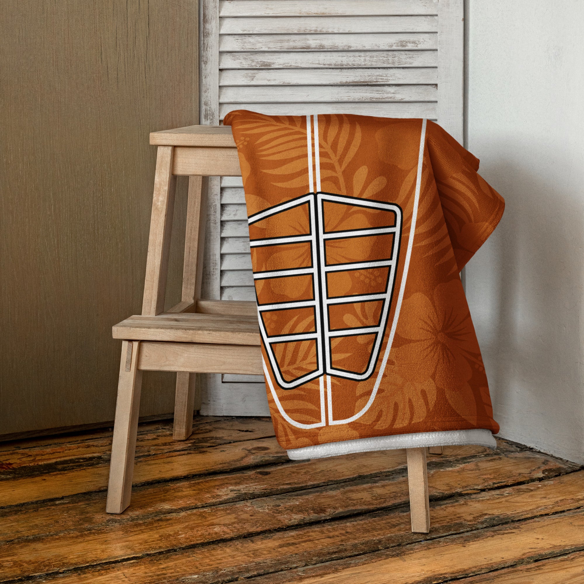 AI generated image of a Clay Hibiscus Surf Pop-Up Training Mat – Oversized Quick-Dry Beach Towel with Stance Placement Guide on chair
