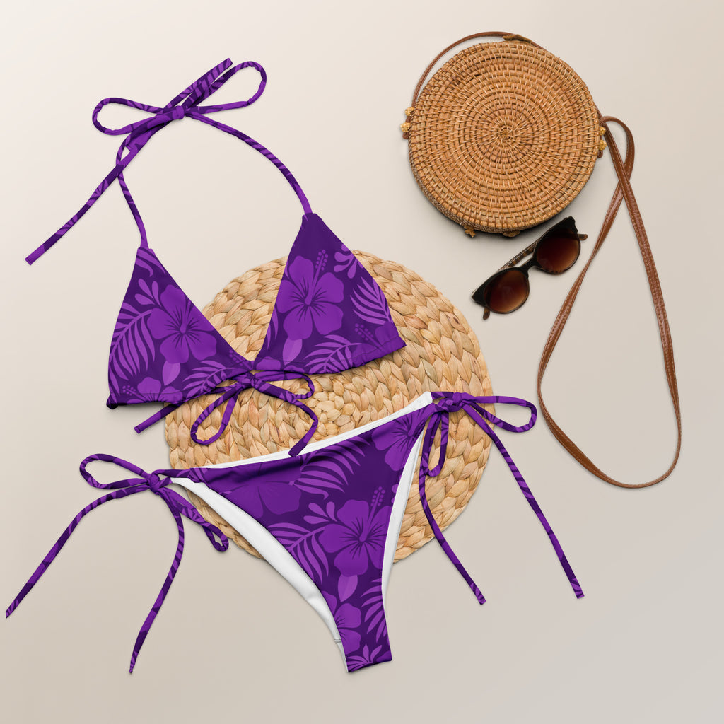 AI generated image of a Purple Hibiscus pattern recycled string bikini Product shot with accessories