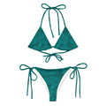 AI generated image of a Teal Hibiscus pattern recycled string bikini Product shot Front