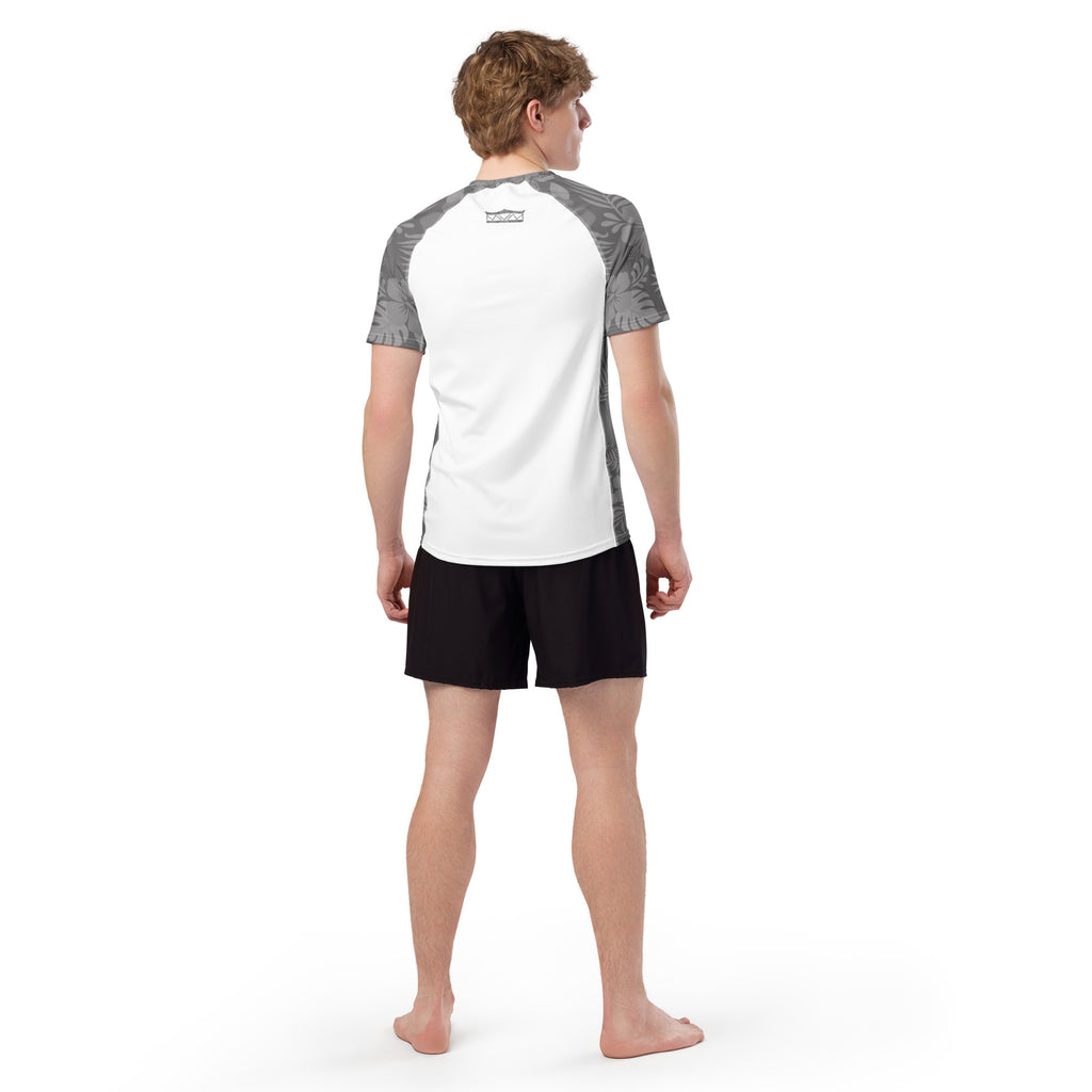 Majestic Vision Grey Hibiscus and white recycled rash vest with UPF 50+ protection, moisture-wicking performance fabric and bold surf-inspired artwork. Recycled Short Sleeved Rash Guard from behind Product mockup studio style