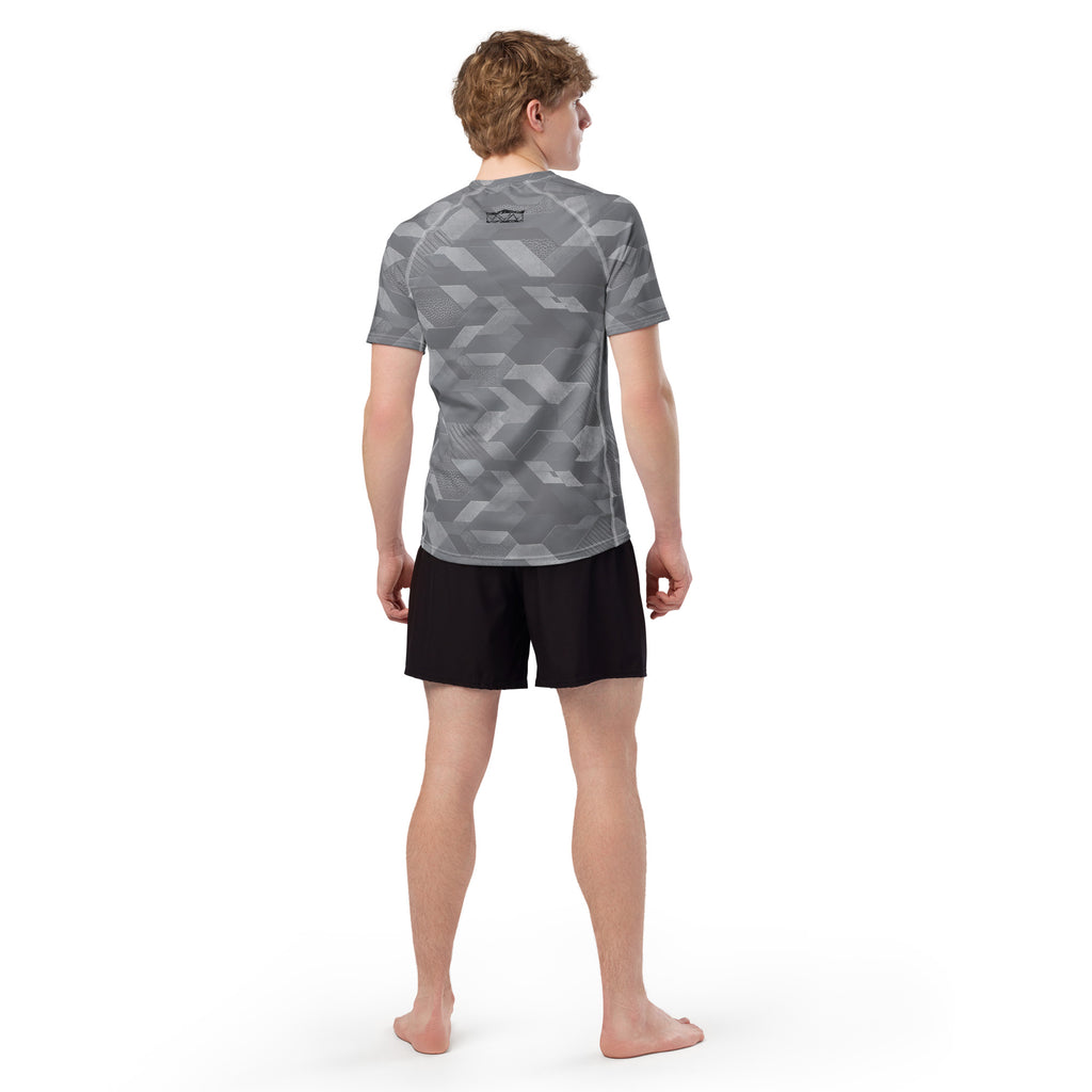MVM Grey Sci Fi Camo recycled rash vest with UPF 50+ protection, moisture-wicking performance fabric and bold surf-inspired artwork. Recycled Short Sleeved Rash Guard from behind Product mockup studio style