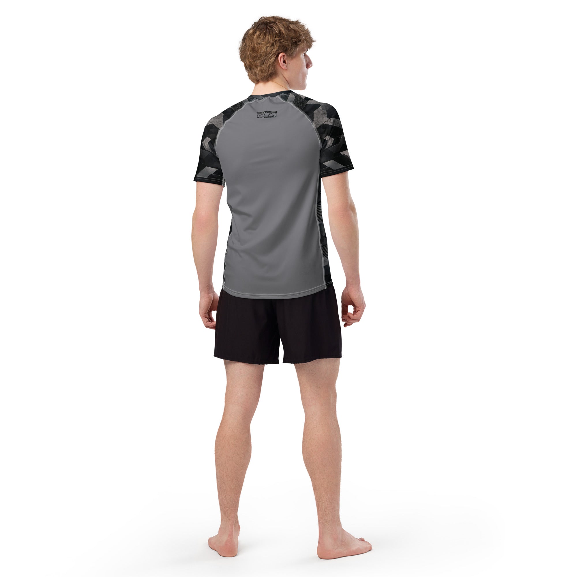 MVM Grey and Black Sci Fi Camo recycled rash vest with UPF 50+ protection, moisture-wicking performance fabric and bold surf-inspired artwork. Recycled Short Sleeved Rash Guard from behind Product mockup studio style