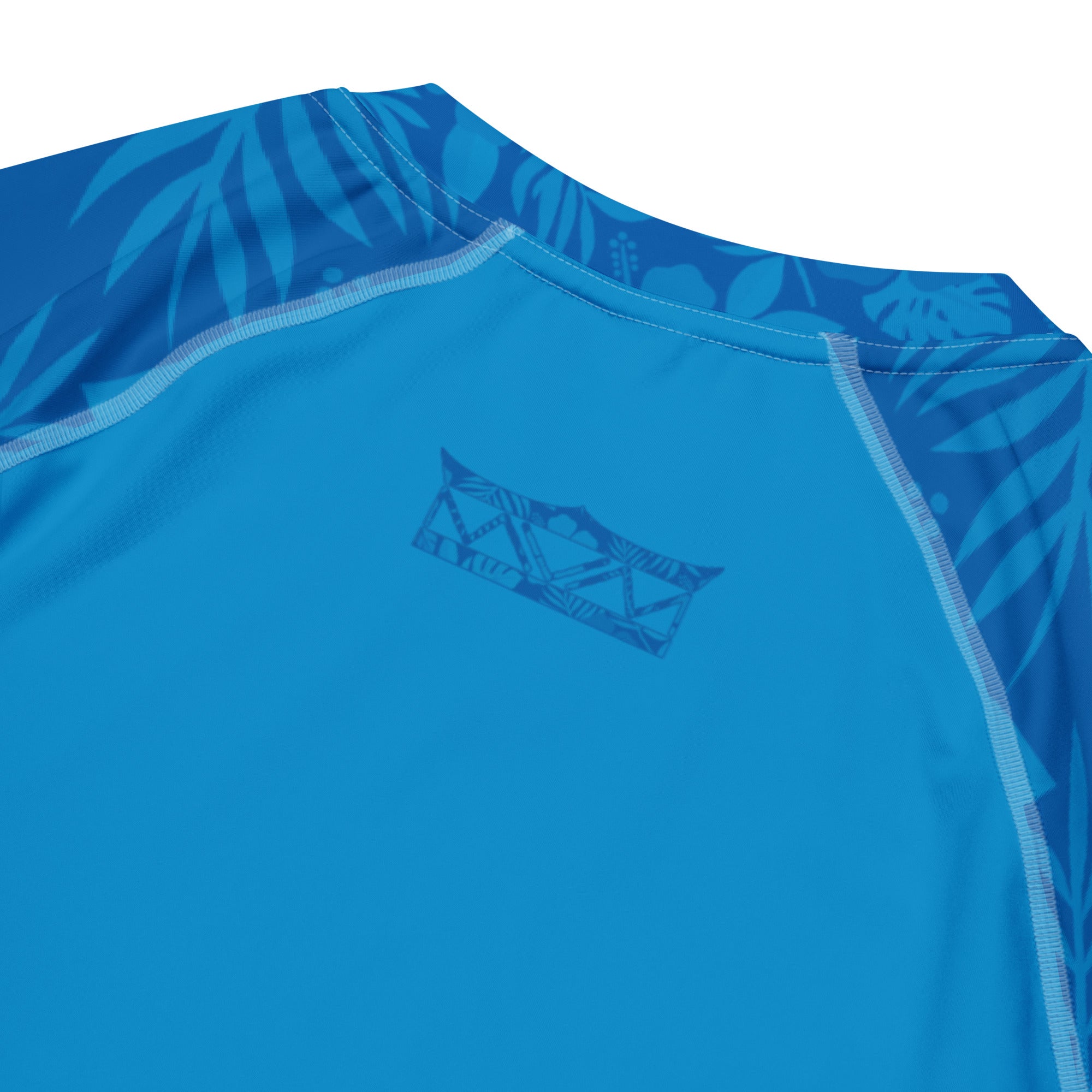 Majestic Vision Ocean Blue Hibiscus recycled rash vest with UPF 50+ protection, moisture-wicking performance fabric and bold surf-inspired artwork. Recycled Short Sleeved Rash Guard back close up Product mockup