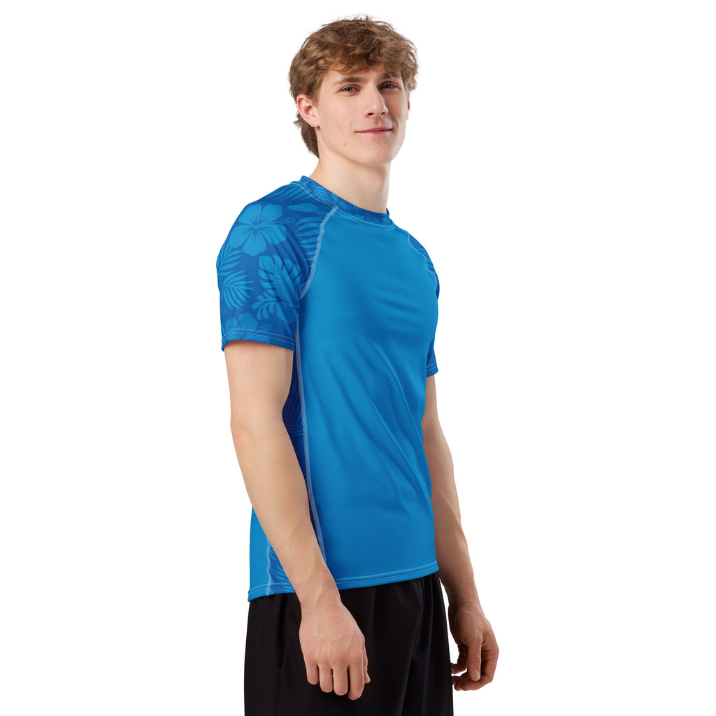 Ocean Blue Hibiscus recycled rash vest with UPF 50+ protection, moisture-wicking performance fabric and bold surf-inspired artwork. Recycled Short Sleeved Rash Guard Product mockup studio style.