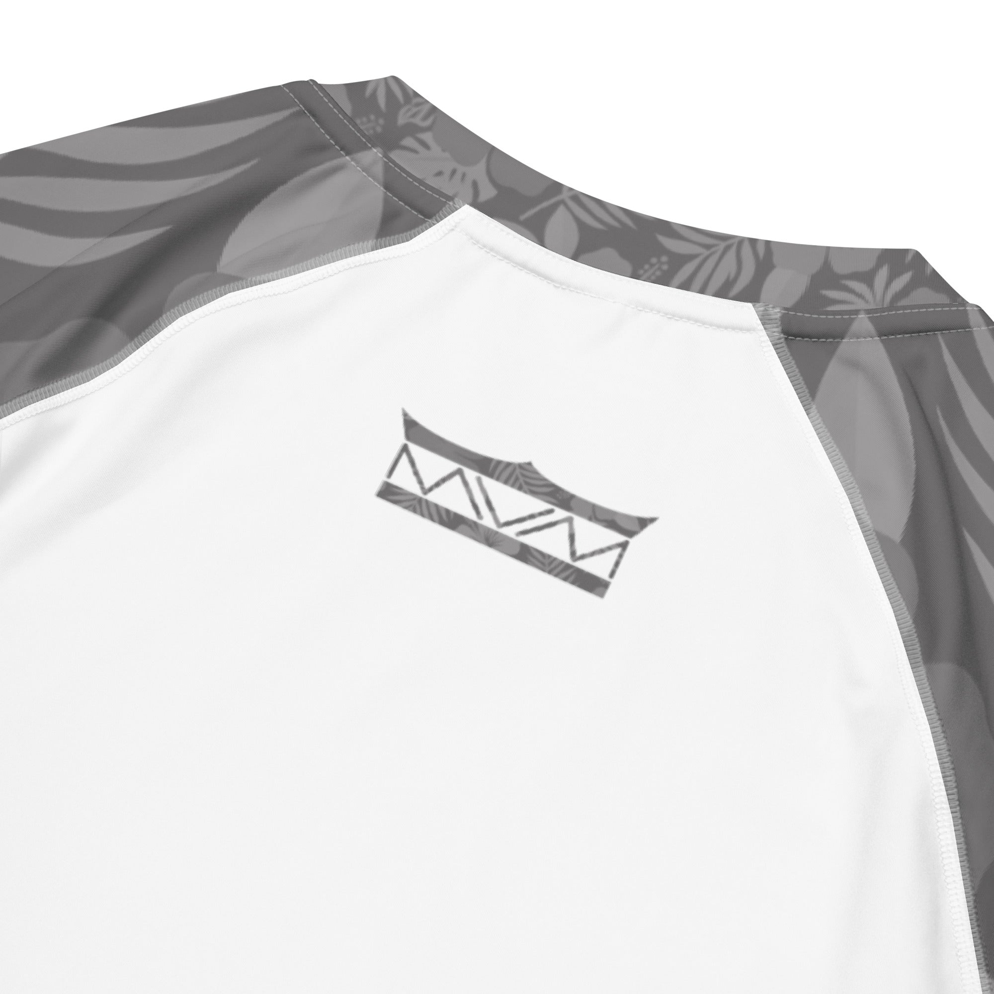 Majestic Vision Grey Hibiscus and white recycled rash vest with UPF 50+ protection, moisture-wicking performance fabric and bold surf-inspired artwork. Recycled Short Sleeved Rash Guard back close up Product mockup